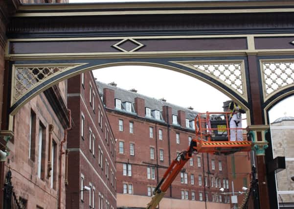The historic gates have been restored to their original colour scheme. Picture: Contributed