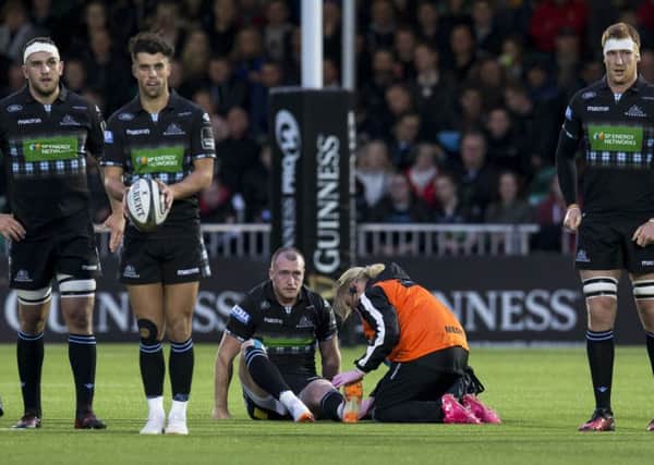 Glasgow Warriors' Stuart Hogg is treated on the pitch during the 25-10 win over Munster. Picture: SNS Group