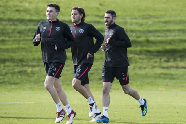 John Souttar, Peter Haring and Michael Smith train hard ahead of the visit of Livingston. Picture: SNS Group