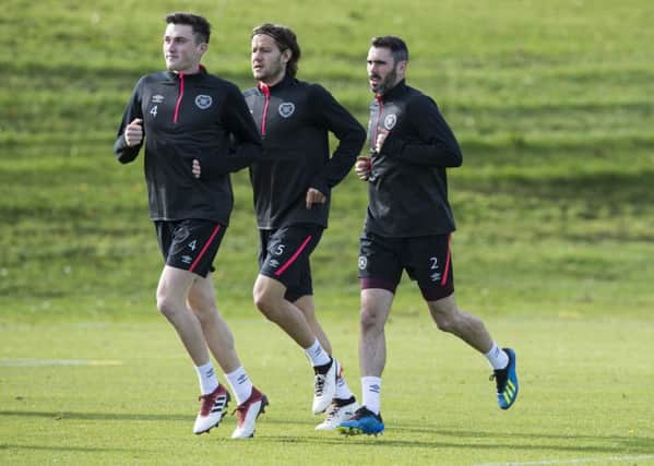 John Souttar, Peter Haring and Michael Smith train hard ahead of the visit of Livingston. Picture: SNS Group