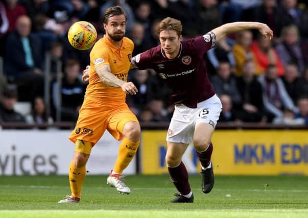Craig Wighton battles Keaghan Jacobs for possession at Tynecastle. Picture: SNS Group