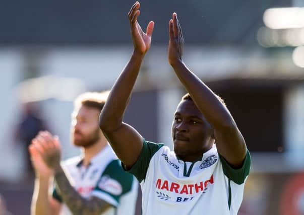Thomas Agyepong salutes the travelling Hibs support. Picture: SNS Group