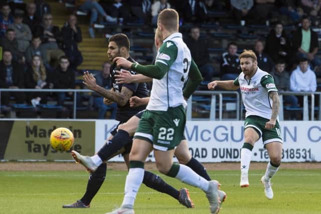 Martin Boyle scores Hibs' second goal at Dens Park. Pic: SNS