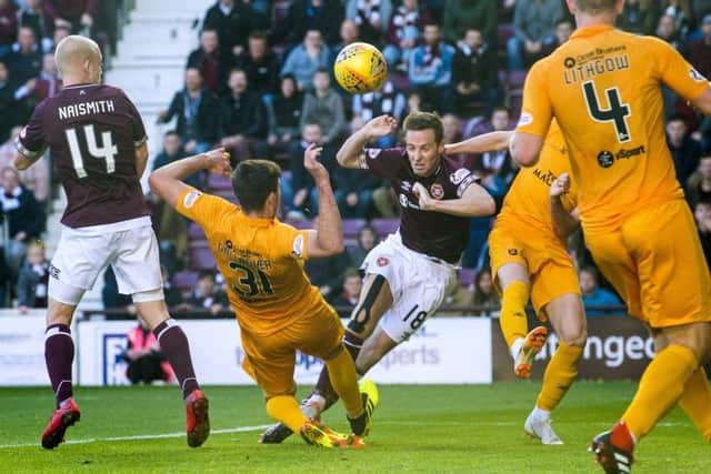Hearts' Steven MacLean is denied by Livingston's Declan Gallagher. Pic: SNS
