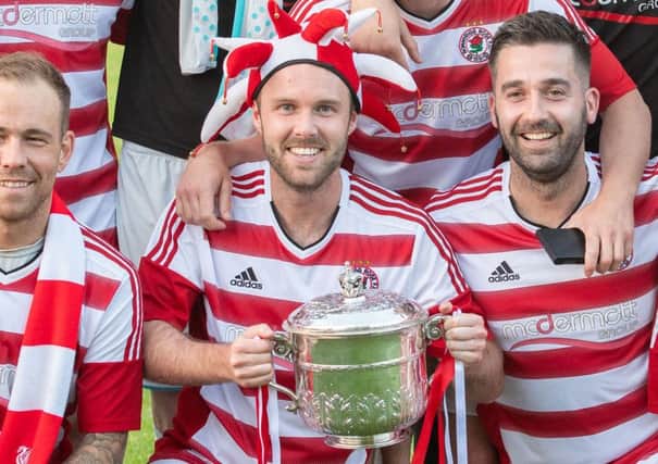 Jonny Stewart, centre, is keen to lift more trophies with Bonnyrigg as a player