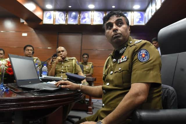 Sri Lanka police chief Pujith Jayasundara, right, at police headquarters in Colombo. Photograph: Ishara S Kodikara/Getty