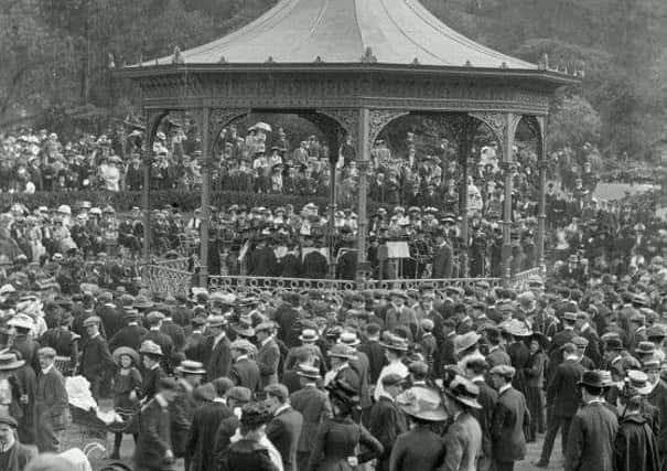 Crowds gather around the bandstand in Princes Street Gardens in 1890