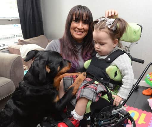 Mum Victoria Cunningham from Uphall in West Lothian  with her nearly two year old daughter Mirry Lindsay and her special dog Alvie
. Victoria is  desperate to scrape together cash for an assistance dog that would change the life of the 2-year-old
