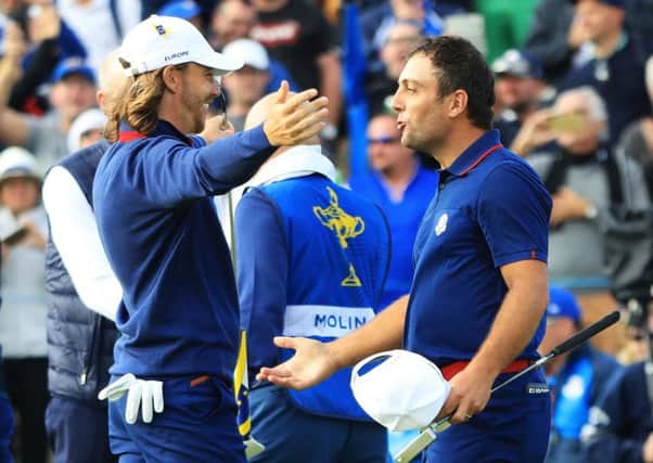 Francesco Molinari of Europe, right, and Tommy Fleetwood celebrate