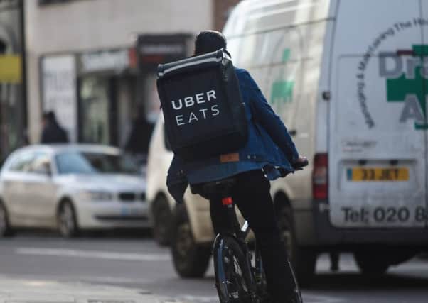 Uber Eats couriers are calling for a minimum drop fee of Â£5 a delivery. Photograph: Getty Images