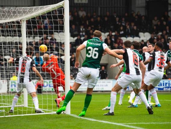 David Gray's header in the 14th minute was enough to give Hibs all three points at St Mirren. Pic: SNS