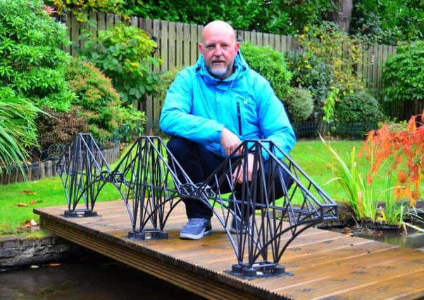 Paul Hewitt with his Forth Rail Bridge sculpture.