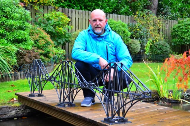 Paul Hewitt with his Forth Rail Bridge sculpture.