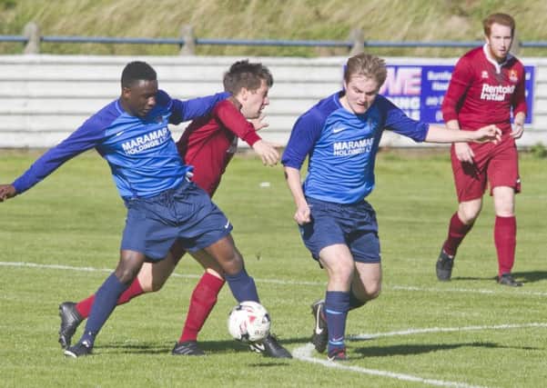 Albert's No 7  & Femi Turay dispossesses an Arniston player in a very hard fought match