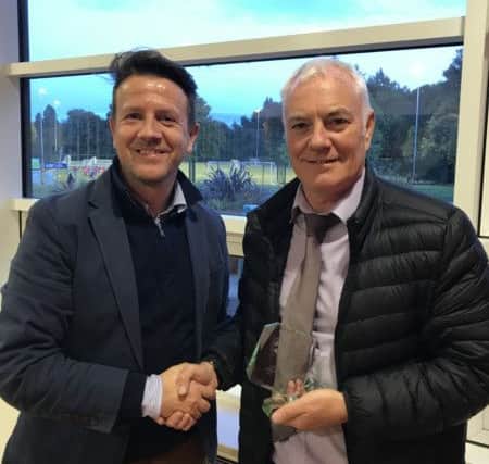 Trophy awarded by Paul Mills (Club Chairman on the left) to Willie McGinlay (on the right).