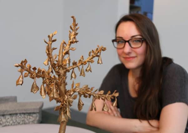 Edinburgh artist Kate Ive with a model showing her Handkerchief Tree memorial design