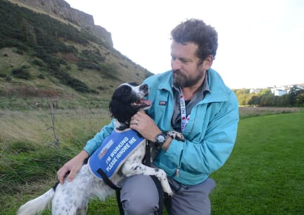 Neil Marshall pictured with his special assistance dog, Arbhair. Picture: Jon Savage