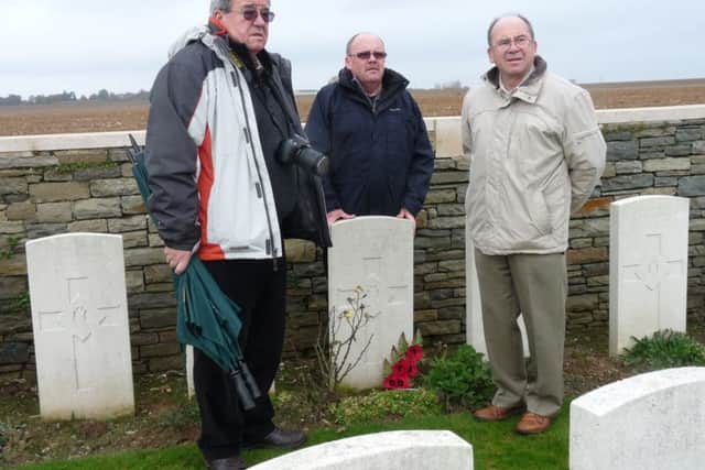Andrew,  Jim and Stewart Renwick at the grave of Archie Renwick at Bouchoir Cemetery