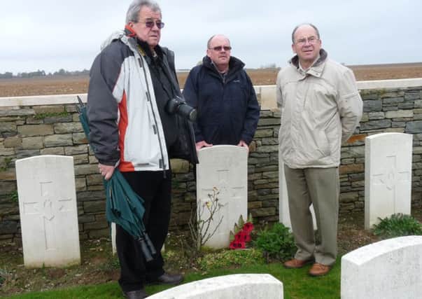 Andrew,  Jim and Stewart Renwick at the grave of Archie Renwick at Bouchoir Cemetery