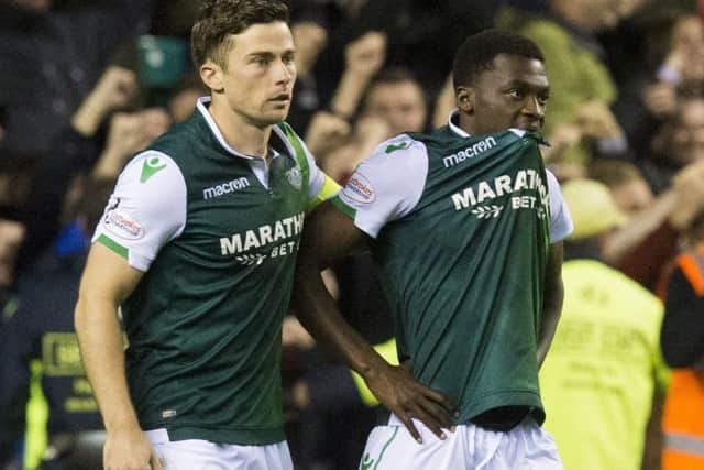 Thomas Agyepong is consoled by Lewis Stevenson after his penalty miss against Aberdeen