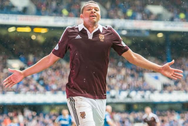 Osman Sow celebrates his last-gasp winner at Ibrox in 2014