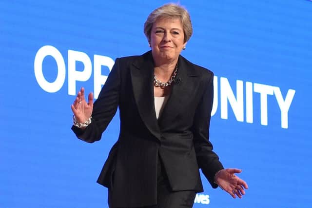 Theresa May takes the opportunity to bust some moves to Abba at the Tory Party conference. Picture: AFP