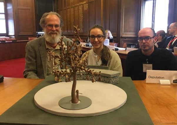 Brian Larkin and Kate Ive with a model of the sculpture. Picture: Contributed