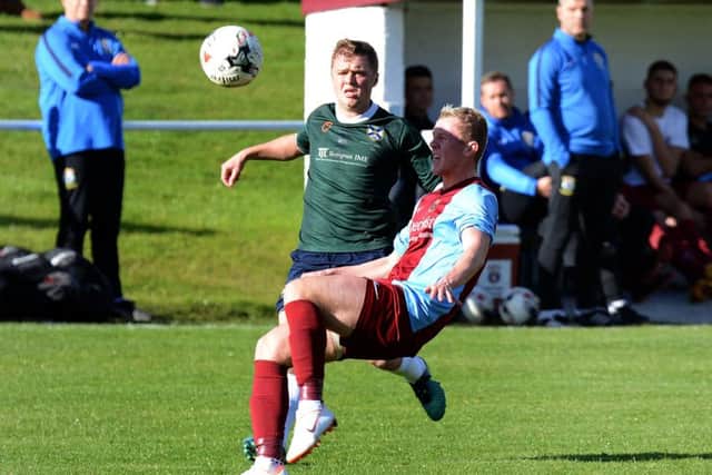 Edinburgh Uni's Luke Murray (in green) battles with Kevin Keane.Pic: Jon Savage