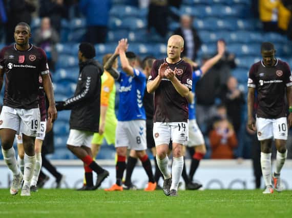 The Hearts players show their disappointment at Ibrox.