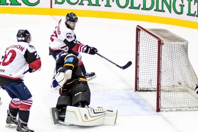 Racers star Michael Ireland tucks in a goal at the back door to make it 4-2. Picture: Ian Coyle