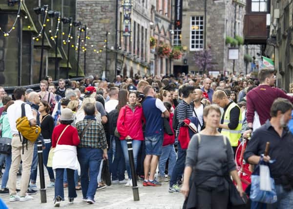 Tourists, like these on the Royal Mile, could be a source of extra tax revenue but there are concerns a 'transient visitor levy' might drive them away