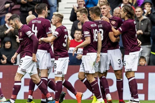 Hearts sit top of the league after a quite remarkable turnaround in squad and style. Picture: SNS/Roddy Scott