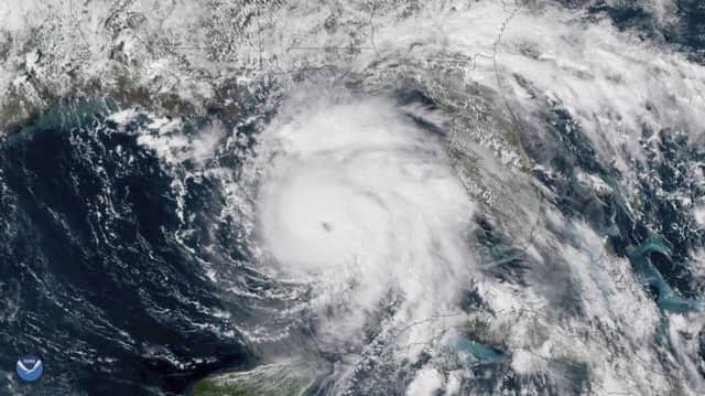 This Tuesday, Oct. 9, 2018 satellite image provided by NOAA shows Hurricane Michael, center, in the Gulf of Mexico. (NOAA via AP)