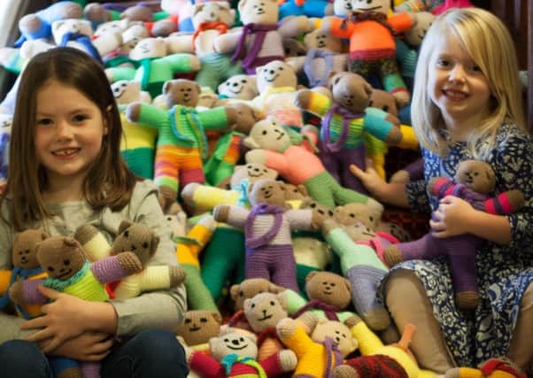 Sisters Natalie (left) and Jessica Laing with some of the bears knitted by members of the Queensferry Parish Church congregation