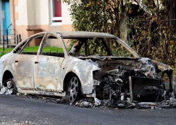 One of the burned out cars after trouble in Craigentinny during last year's Bonfire Night celebrations. Picture: Lisa Ferguson