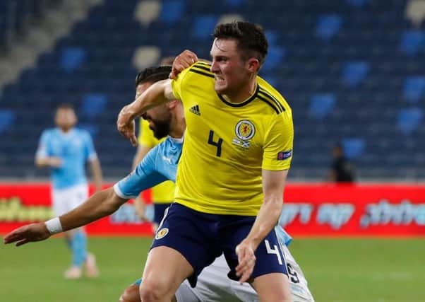 John Souttar picked up a second booking for this coming together with Munas Dabbur. Pic: AFP