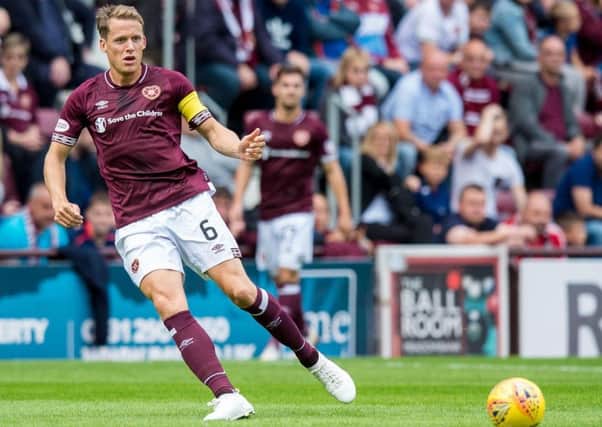 Christophe Berra was injured during Hearts' win over Celtic. Picture: SNS