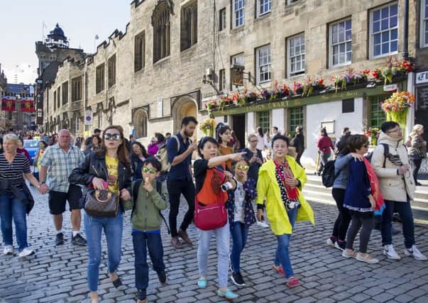 Tourists on the Royal Mile/High Street, Edinburgh during the Edinburgh International Festival. Picture: Ian Rutherford