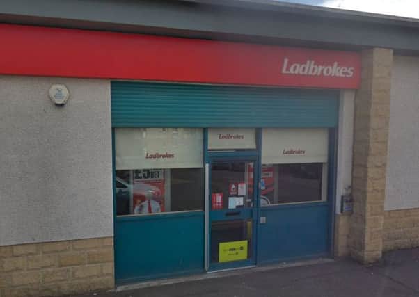 The suspect held up a Ladbrokes shop in Hawk Brae, Livingston. Picture: Google Maps