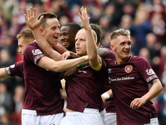 The Hearts players celebrate with Steven Naismith after the stand-in captain put the Tynecastle side 2-0 up.