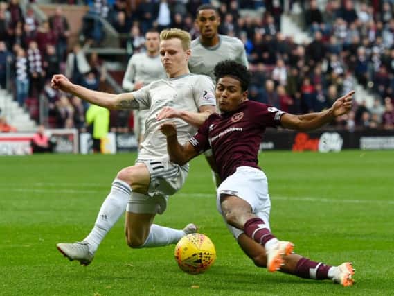 Demetri Mitchell vies for possession with Aberdeen winger Gary Mackay-Steven.