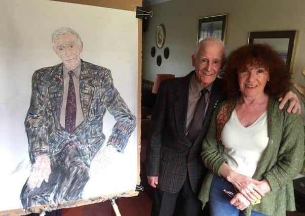 Lothian Birth Cohorts member John Scott with artist Fionna Carlisle and his portrait which went on display on Sunday. Picture: Contributed