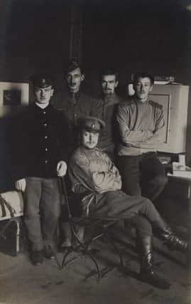 Lt Ian Hamilton with French and Russian friends at Burg-bei-Magdeburg Camp, 1916.