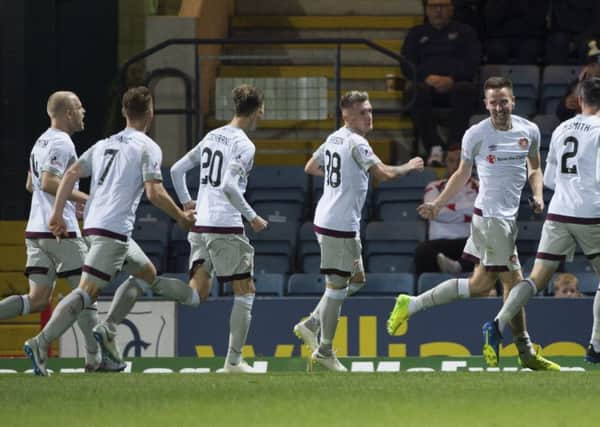 Steven MacLean (far right) celebrates scoring his side's third goal. Picture: SNS Group