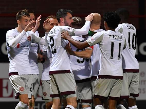 Hearts players celebrate as they moved six points clear at the top of the Premiership.