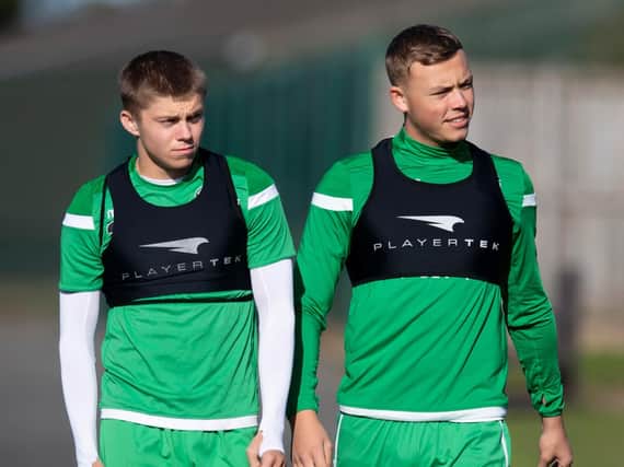 Fraser Murray, left, and Ryan Porteous have signed long-term contracts at Hibs. Pic: SNS
