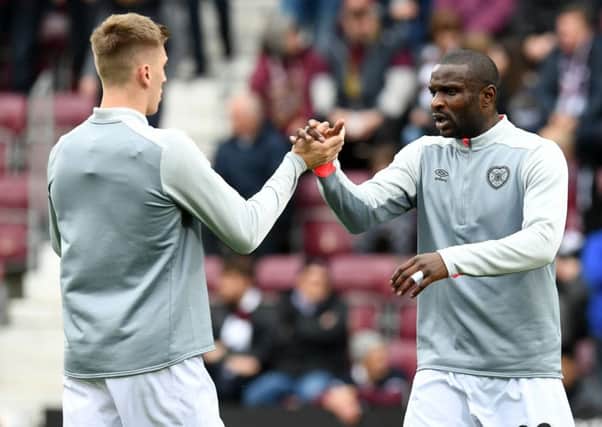 Jimmy Dunne and Clevid Dikamona will line up in the centre of defence on Sunday for Hearts against Celtic. Pic: SNS