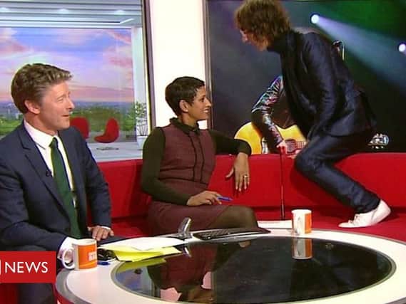 Richard Ashcroft leaps over the sofa. Pic: BBC screenshot