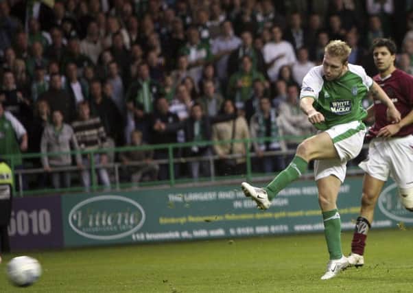 Garry O'Connor slams the ball into the net to double Hibs' lead against Hearts