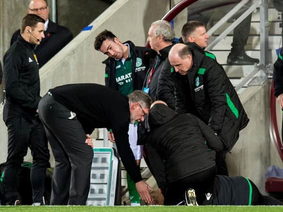 Hearts boss Craig Levein checks on Neil Lennon in the technical area. Pic: SNS